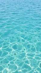 Obraz premium Rippling waves on a clear blue water surface, serene, waves