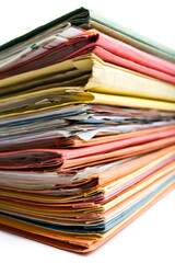 stack of filled  file folders in various colors