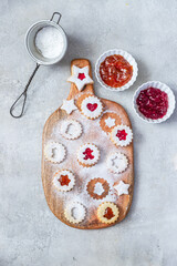 Traditional Christmas Linzer cookies with raspberry and apricot jam 