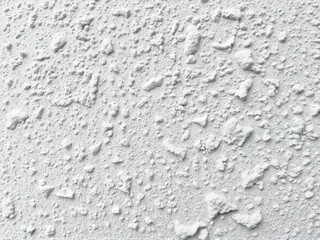 Obraz premium White powder texture on a surface resembling flour or chalk in natural light
