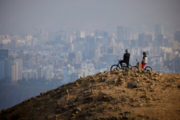 Carving down the epic trails of El Morro Solar. Whit the view of pacific Ocean and Lima on the background. Chorrillos, Lima, Peru