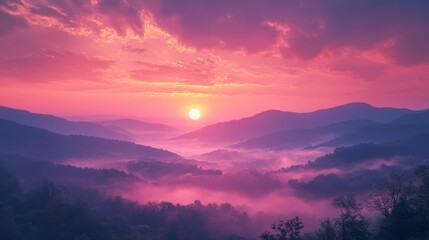 Obraz premium Pink Sunrise Over Misty Mountain Ranges