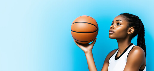 African American female basketball player isolated on a blue background