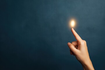 A hand touching a glowing light against a dark background, symbolizing inspiration, creativity, or a moment of discovery.