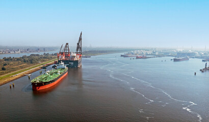 Obraz premium Aerial from industry in the harbor of Rotterdam in the Netherlands