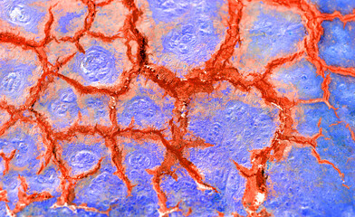 Inverted photograph of macro structures on a rusty steel plate with oily cracks. Surreal negative...