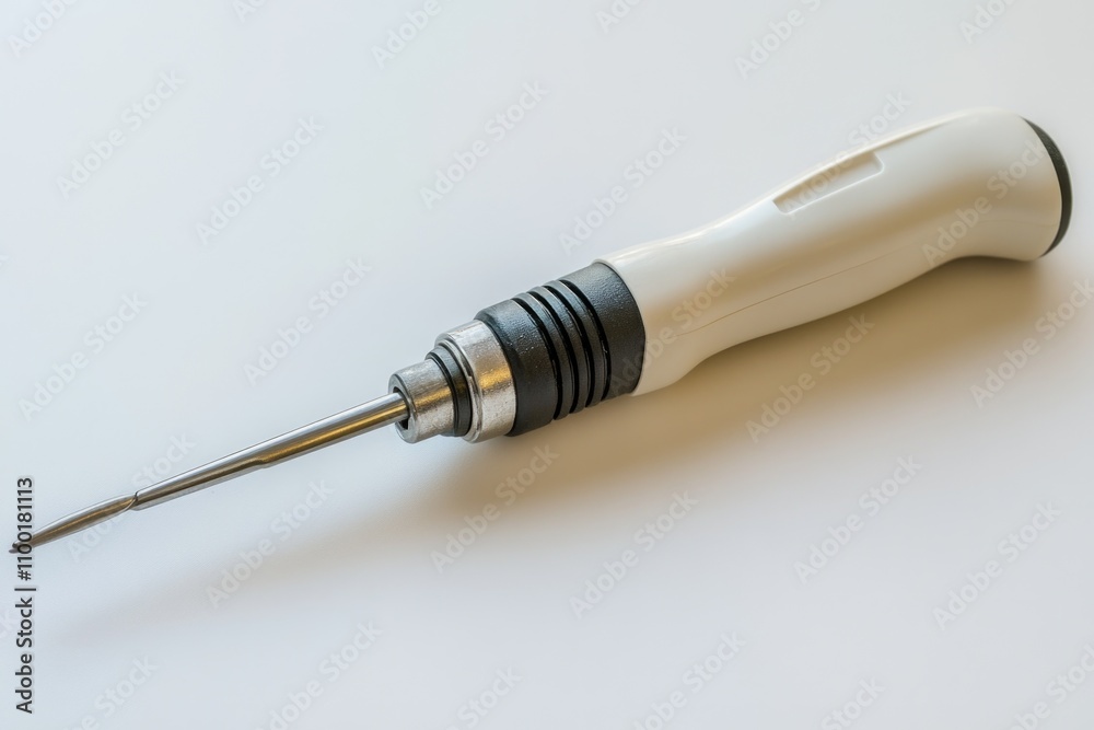 Poster A close-up view of a screwdriver lying on a table, perfect for use in DIY or repair contexts