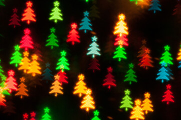 Christmas background, blurred festive multicolor bokeh wallpaper, holiday Christmas glowing lights with shining Christmas trees