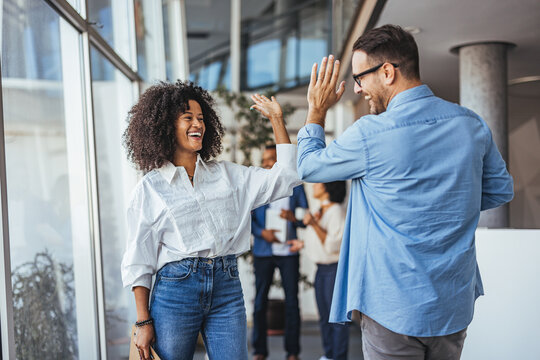 Joyful Colleagues Celebrating Success With a Lively High Five