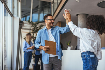 Happy Office Team Celebrating Success With High Five