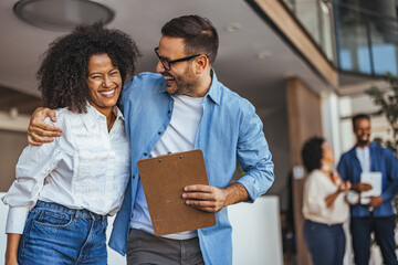 Colleagues Sharing a Joyful Moment in Modern Office