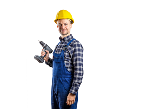 Smiling builder with a hard hat holding a cordless screwdriver isolated from background