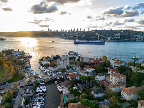 Aerial view of anatolian fortress and rumeli fortress along the bosphorus at sunset, anadolu hisari, istanbul, turkey.