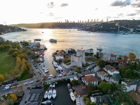 Aerial view of anadolu fortress and boats on the bosphorus at sunset, istanbul, turkey.