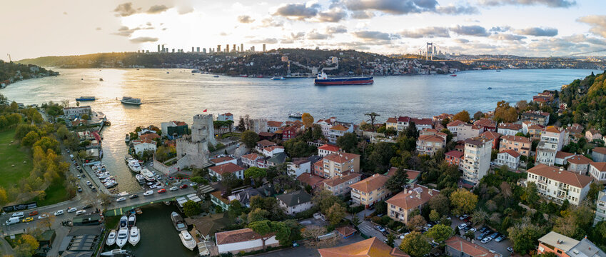 Aerial view of anadolu hisari with anatolian fortress and rumeli fortress along the bosphorus at sunset, istanbul, turkey.