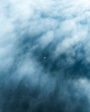 Aerial view of serene and ethereal clouds above a tranquil landscape, Uerikon, Switzerland.