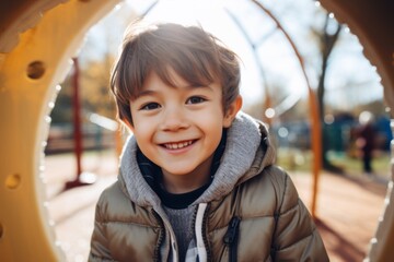 Smiling portrait of a boy in playground