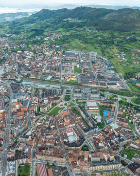 Aerial view of historic Oviedo City with beautiful medieval architecture and scenic mountains, Asturias, Spain.