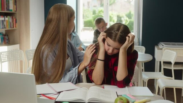 Caucasian girls high school students pupils classmates education studying problem upset teen woman sad crying offended bullying university college trouble female apologize calm help support friends
