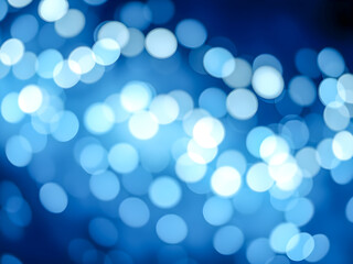 Glowing blue bokeh lights create a magical Christmas backdrop