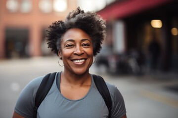 Naklejka premium Smiling portrait of a middle aged slightly overweight woman in gym