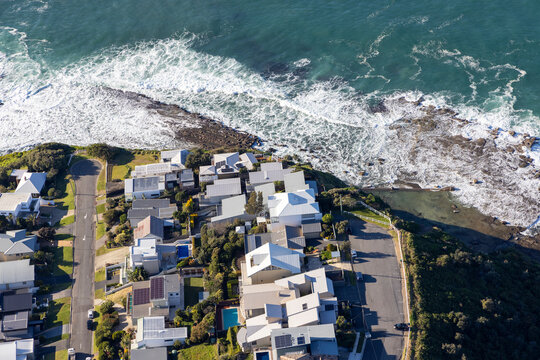 Aerial view of beautiful residential area with coastline and waves, Merewether, Newcastle, New South Wales, Australia.