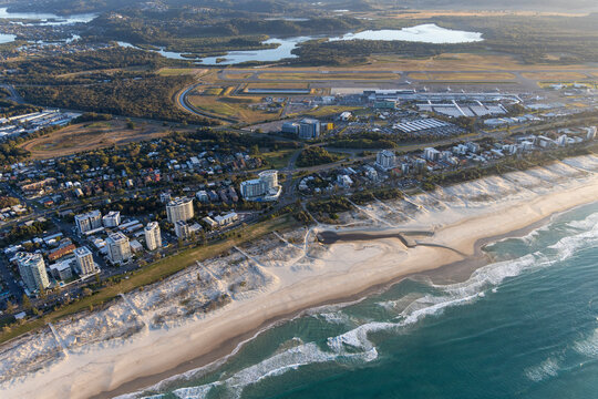 Aerial view of kirra beach with beautiful sandy shore and urban skyline, Coolangatta, Australia.