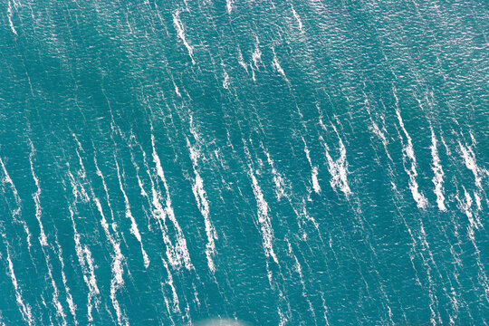 Aerial view of serene warrnambool bay with calm ocean waves and tranquil blue water, Warrnambool, Australia.