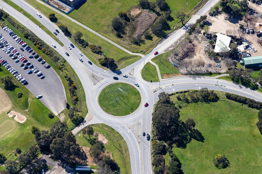 Aerial view of a beautiful urban landscape featuring a roundabout and traffic with cars, Cranbourne South, Victoria, Australia.