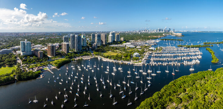 Aerial view of coconut grove marina with sailboats and cityscape, Coconut Grove, Florida, USA.