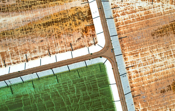 Aerial view of ammonium nitrate plant with geometric patterns and colorful textures, Burrup Peninsula, Australia.