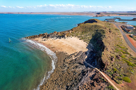 Aerial view of beautiful Honeymoon Cove Beach with sandy shore and rocky cliffs, Point Samson, Australia.