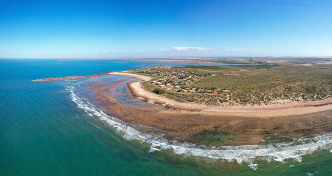Aerial view of serene and beautiful Point Samson foreshore with sandy beach and gentle waves, Point Samson, Australia.