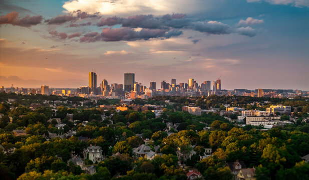 Aerial view of boston skyline at sunset with beautiful clouds and greenery, jamaica plain, united states.
