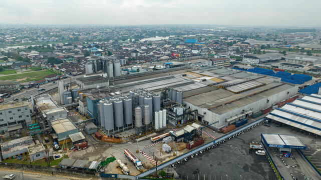 Aerial view of pabod breweries and industrial complex in a cloudy urban landscape, Obia, Nigeria.