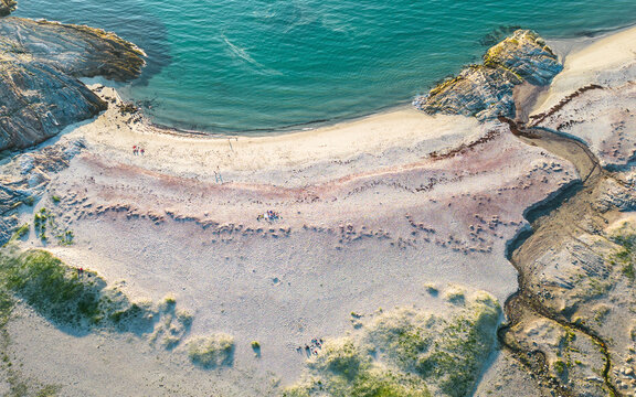 Aerial view of tranquil sand beach and coastline under the midnight sun, Bodo, Norway.