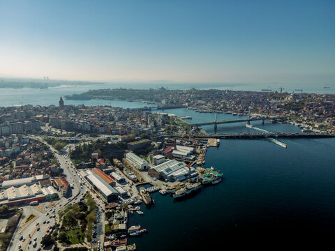 Aerial view of beautiful cityscape with historic buildings and Ataturk Bridge over the Bosphorus, Beyoglu, Turkiye.