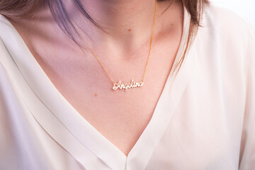 Name necklace on young woman