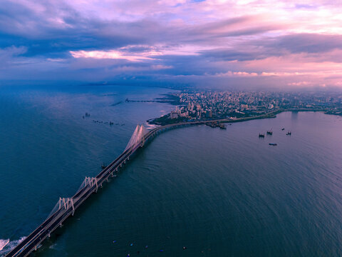 Aerial view of the beautiful Sealink bridge connecting the vibrant city of Mumbai to the Arabian Sea at sunset, Worli, India.