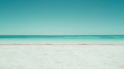 Tranquil Beach with Clear Water and Cloudless Blue Sky