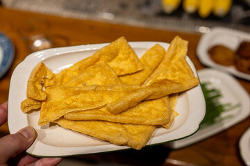 Crispy Fried Tofu Skins on a White Plate