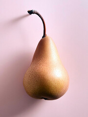 Sweet organic pear on pink background.	