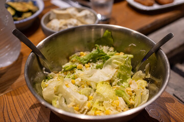 Fresh Green Salad in a Bowl on Dining Table