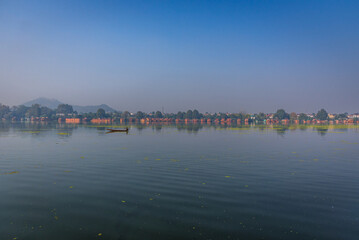View of Nigeen lake during sunrise and the beautiful mountain range in the background in the city of Srinagar, Kashmir, India.