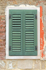 Closed Green Wood Window Shutters Blinds at Burano Island in Venice Italy