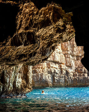 View of blue cave with crystal clear water and rocky formations, Split, Croatia.