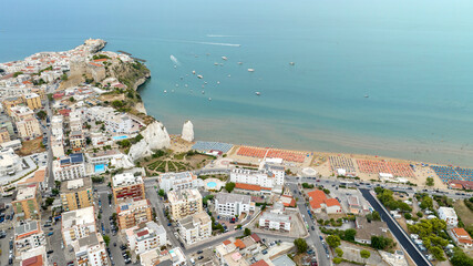 Fototapeta premium Aerial view of the castle and Pizzomunno stack located in Vieste, Puglia, Italy. Beautiful panorama of this tourist destination of Gargano overlooking the Mediterranean Sea.