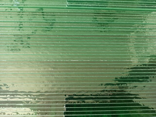 Sheets of glass folded in production. Transparent natural glass