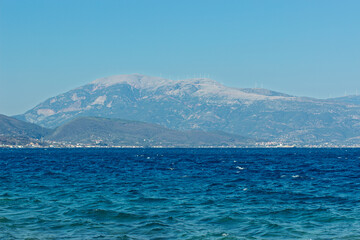 sea scape wavy water panorama landscape with mountain range in mist background view