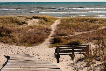 Board walk leading to Lake Michigan beach, with bench at Kohler-Andrae State Park, Sheboygan, Wisconsin